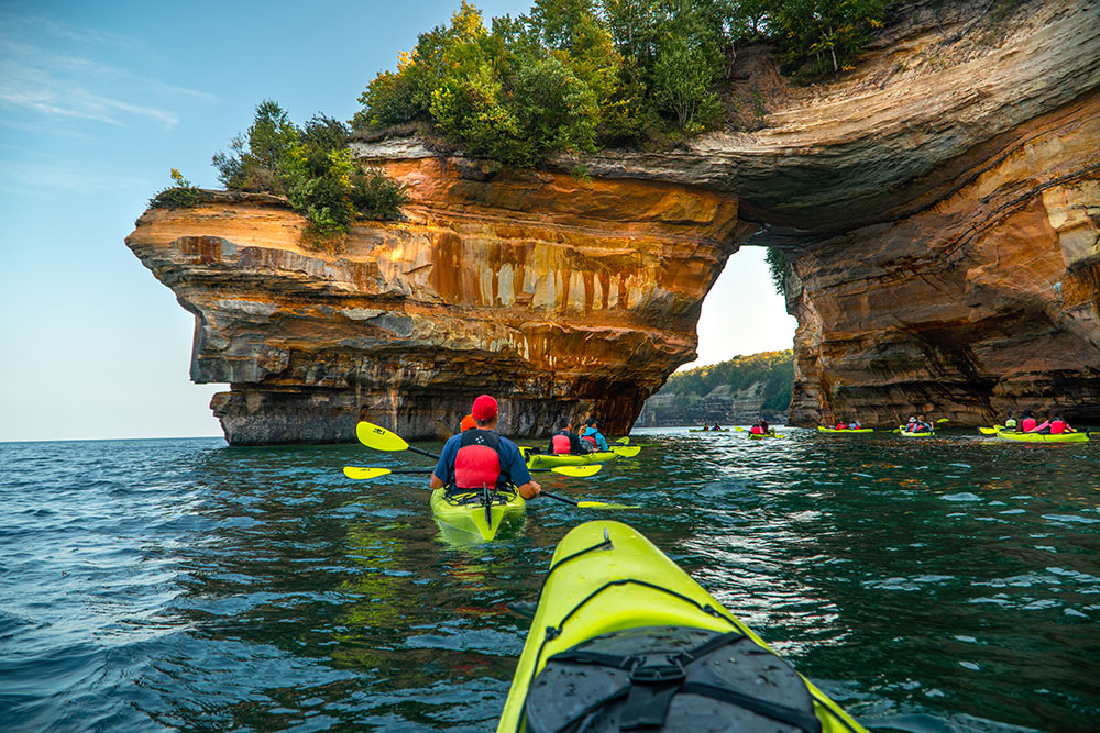 Paddling through Lover’s Leap on a Pictured Rocks Kayaking Tour.