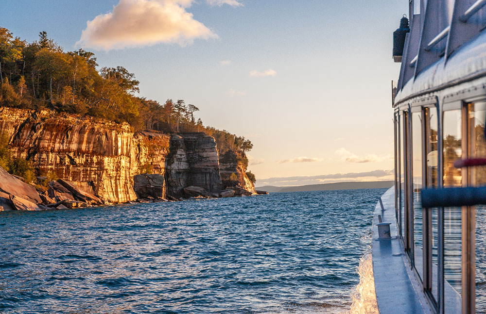 The setting sun reflects off the cliffs. Photo credit: Tim Trombley
