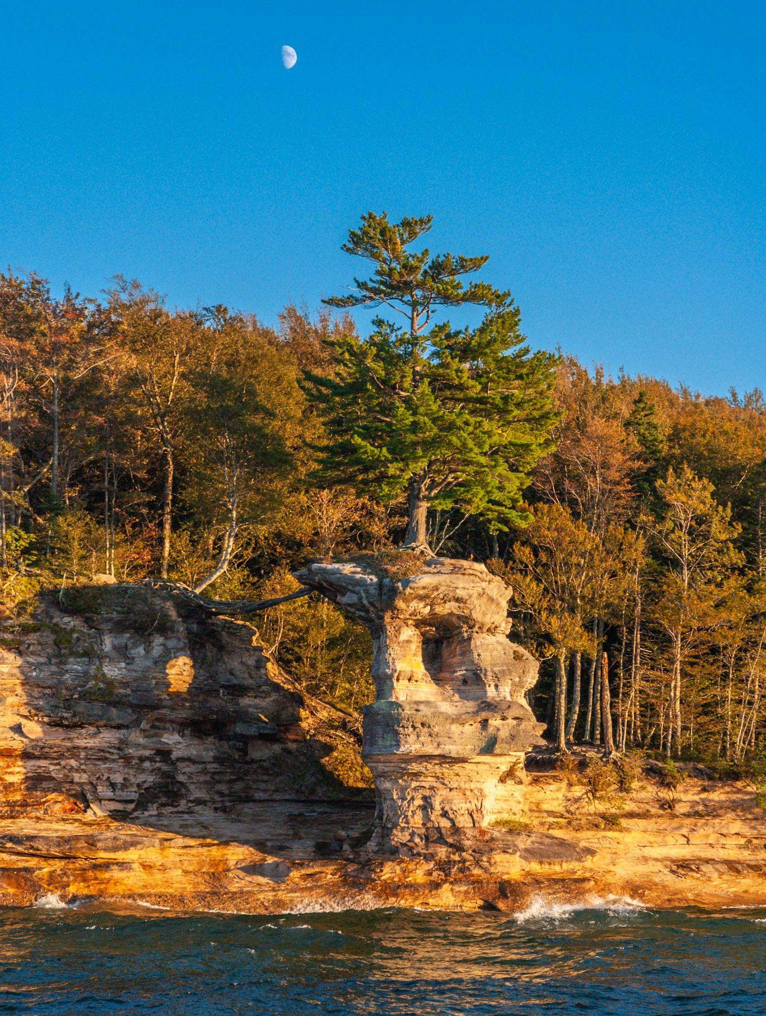 The colors of Chapel Rock are amplified during a sunset in the autumn season.