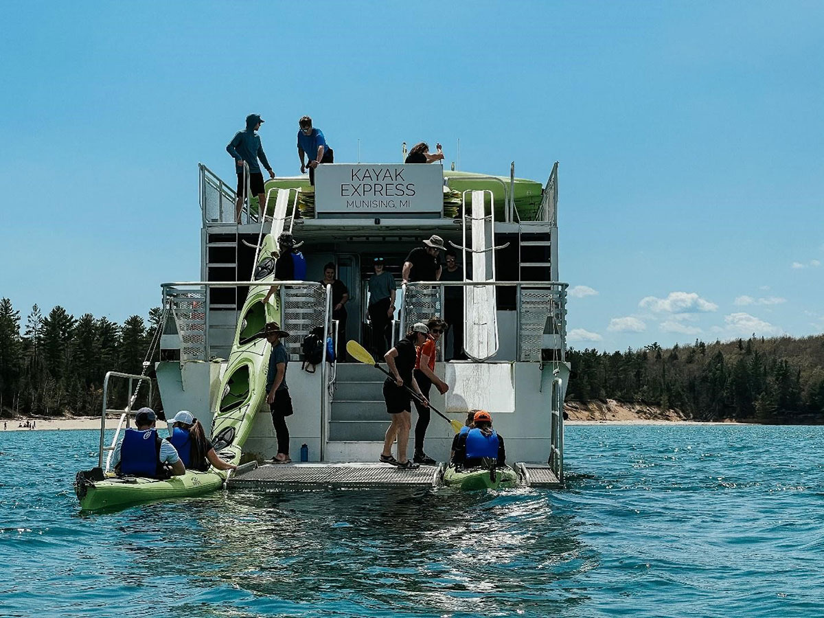 Kayakers boarding the boat