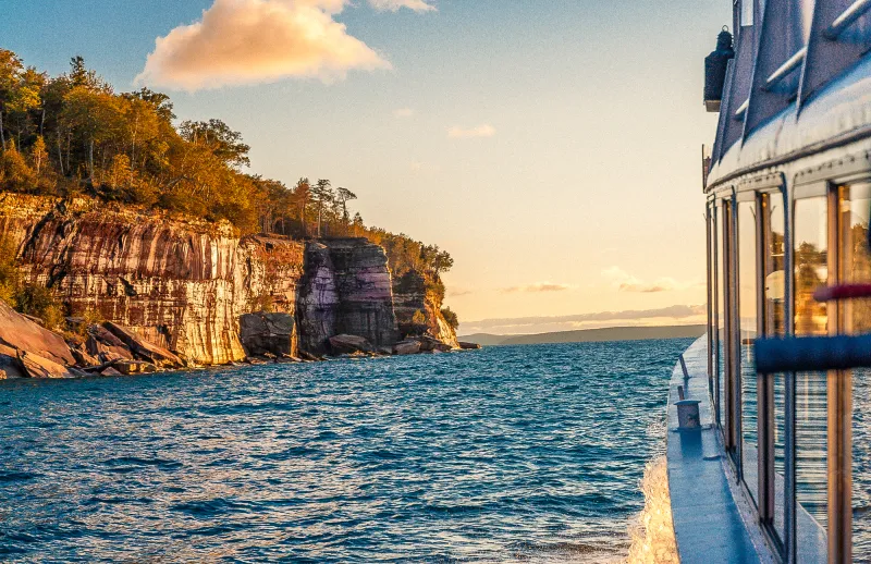 The cliffs illuminating on a sunset cruise