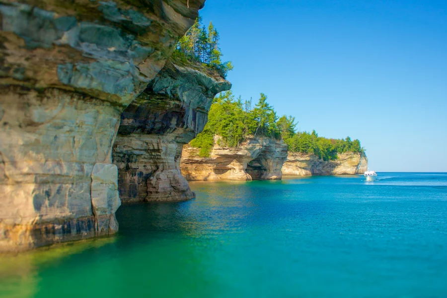 Pictured Rocks Cruises passes by towering cliffs
