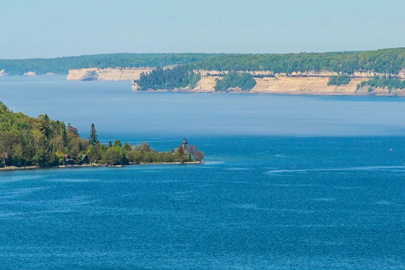 Grand Island: Scenic island view from Pictured Rocks cruises, showcasing Lake Superior's beauty.